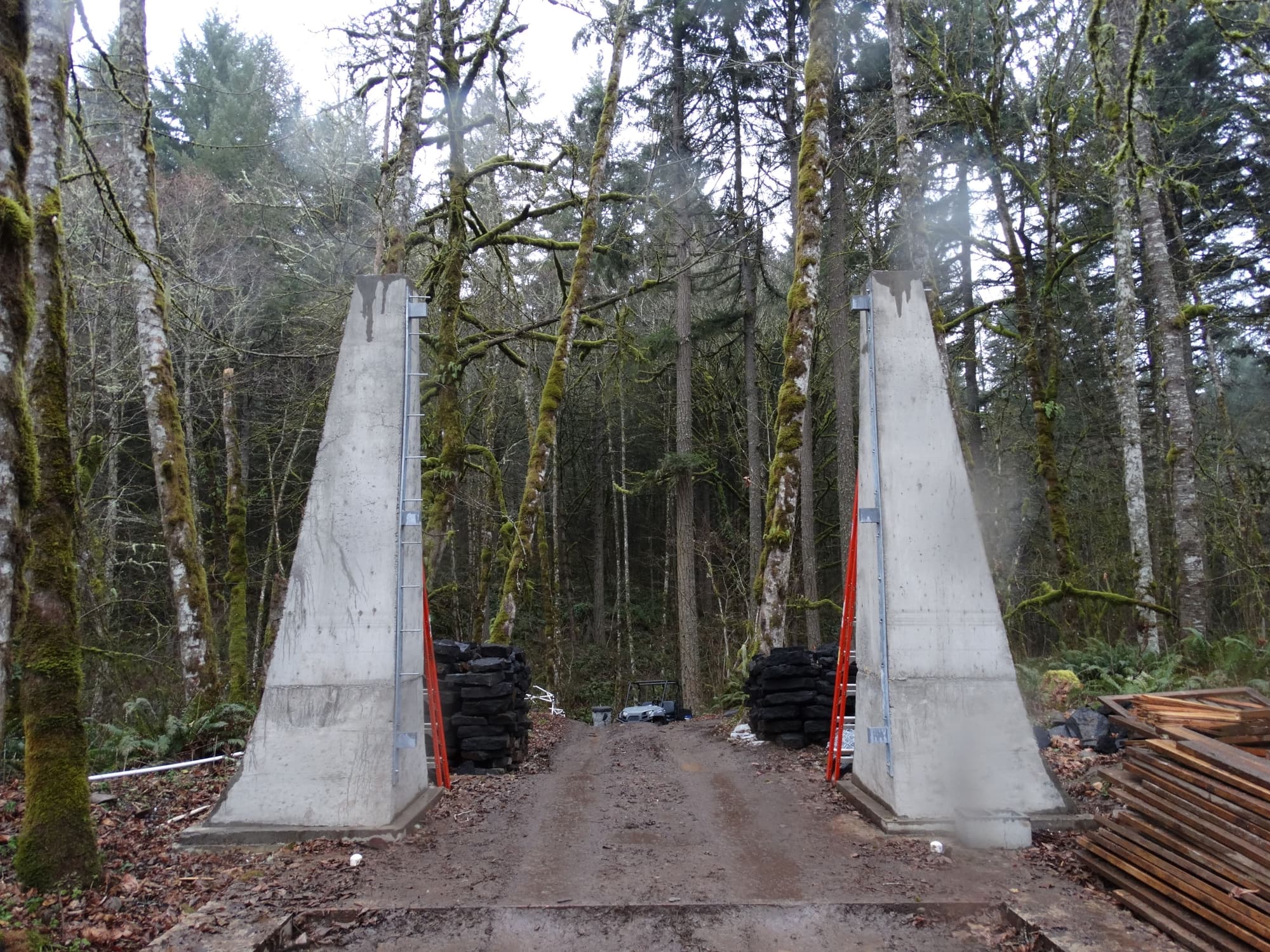 Concrete pylons muddy driveway