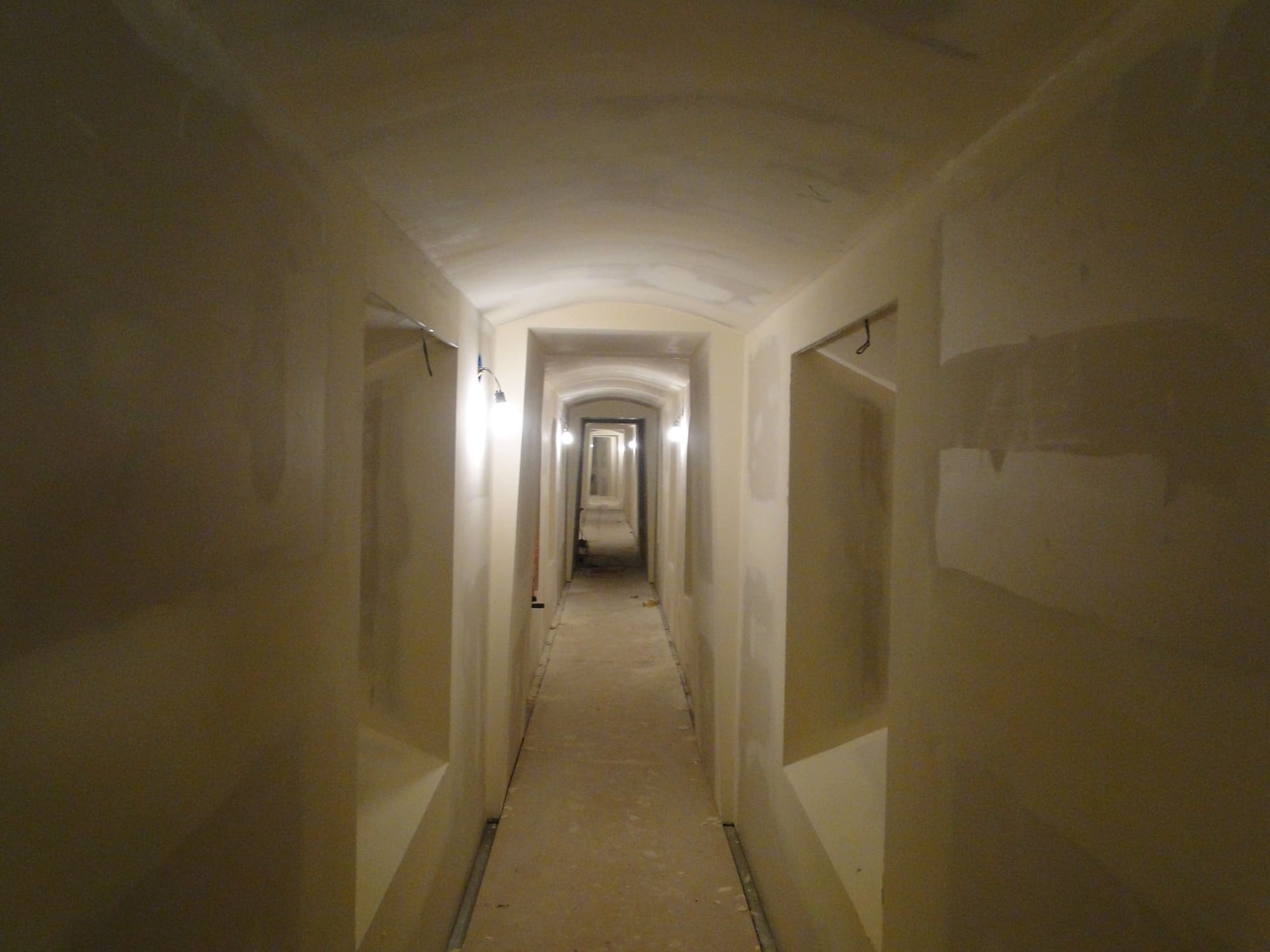 Corridor bare bulb sconces
