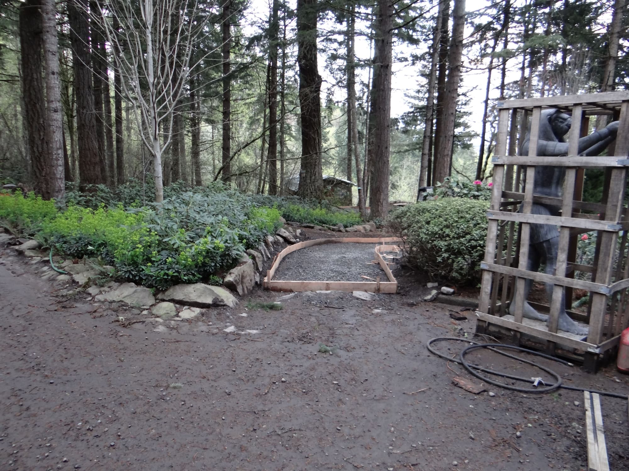 Crated statue garden path