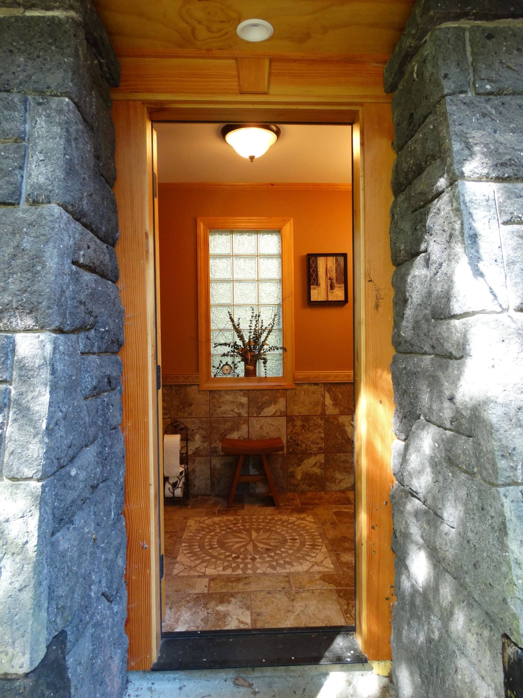 Doorway view tiled bathroom
