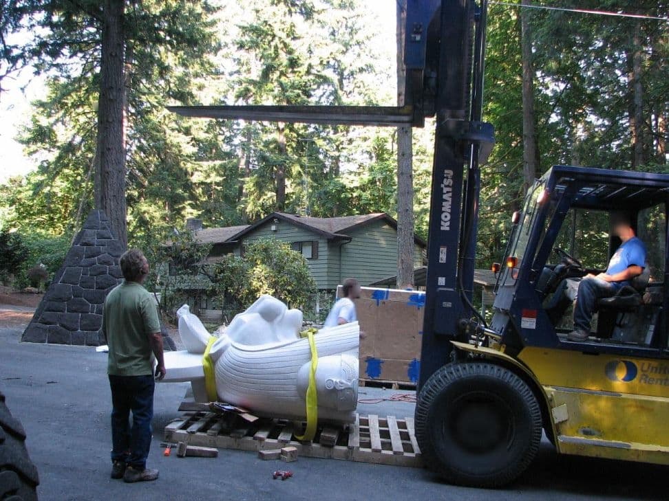 Forklift moving statue headdress