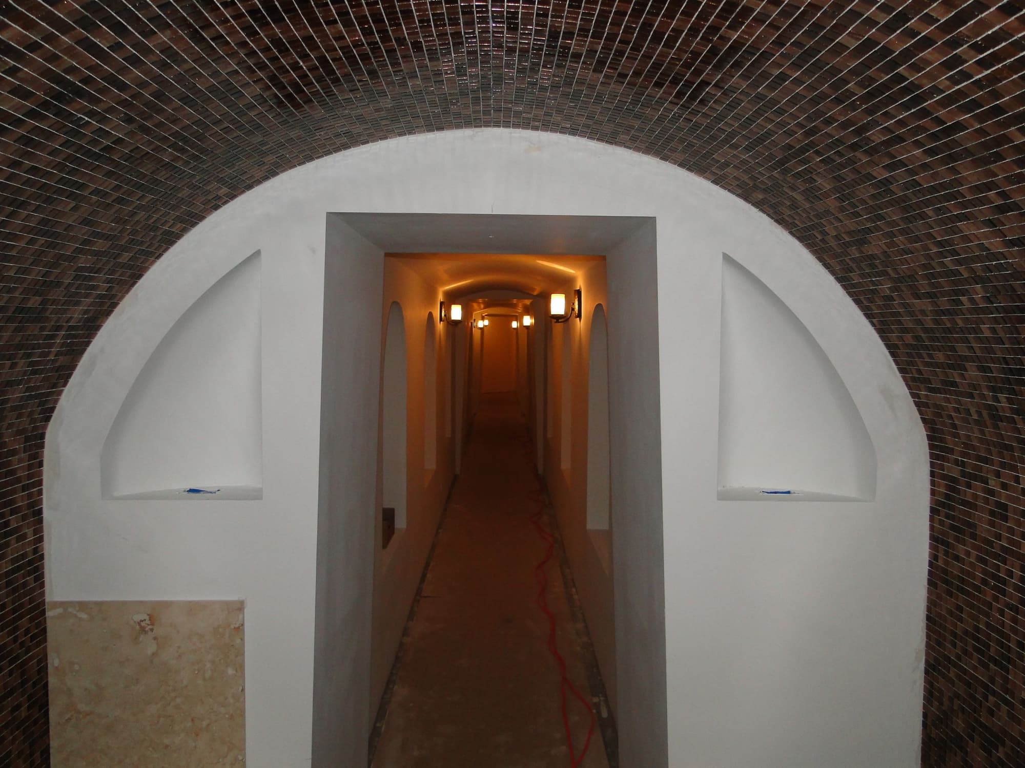 Mosaic arched tunnel hallway