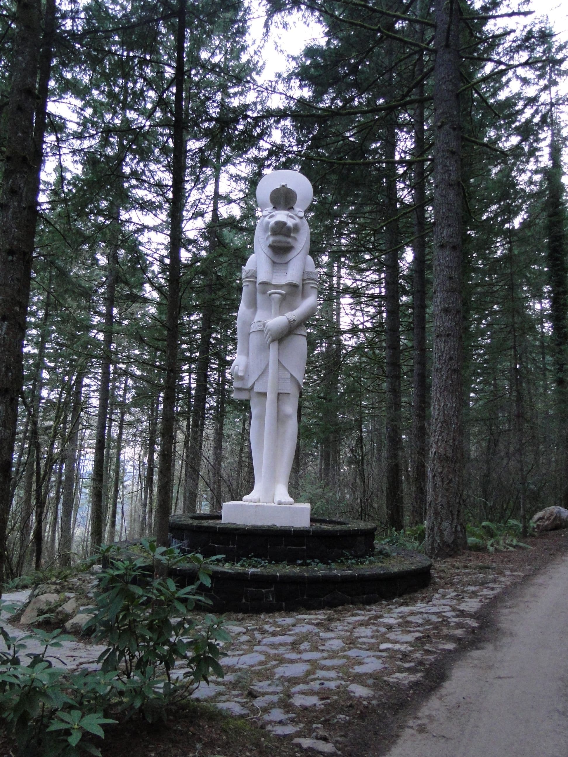 Sekhmet statue forest path