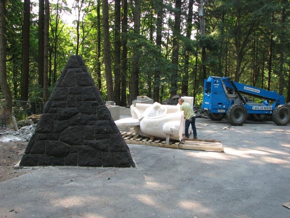 Stone pyramid telehandler statue