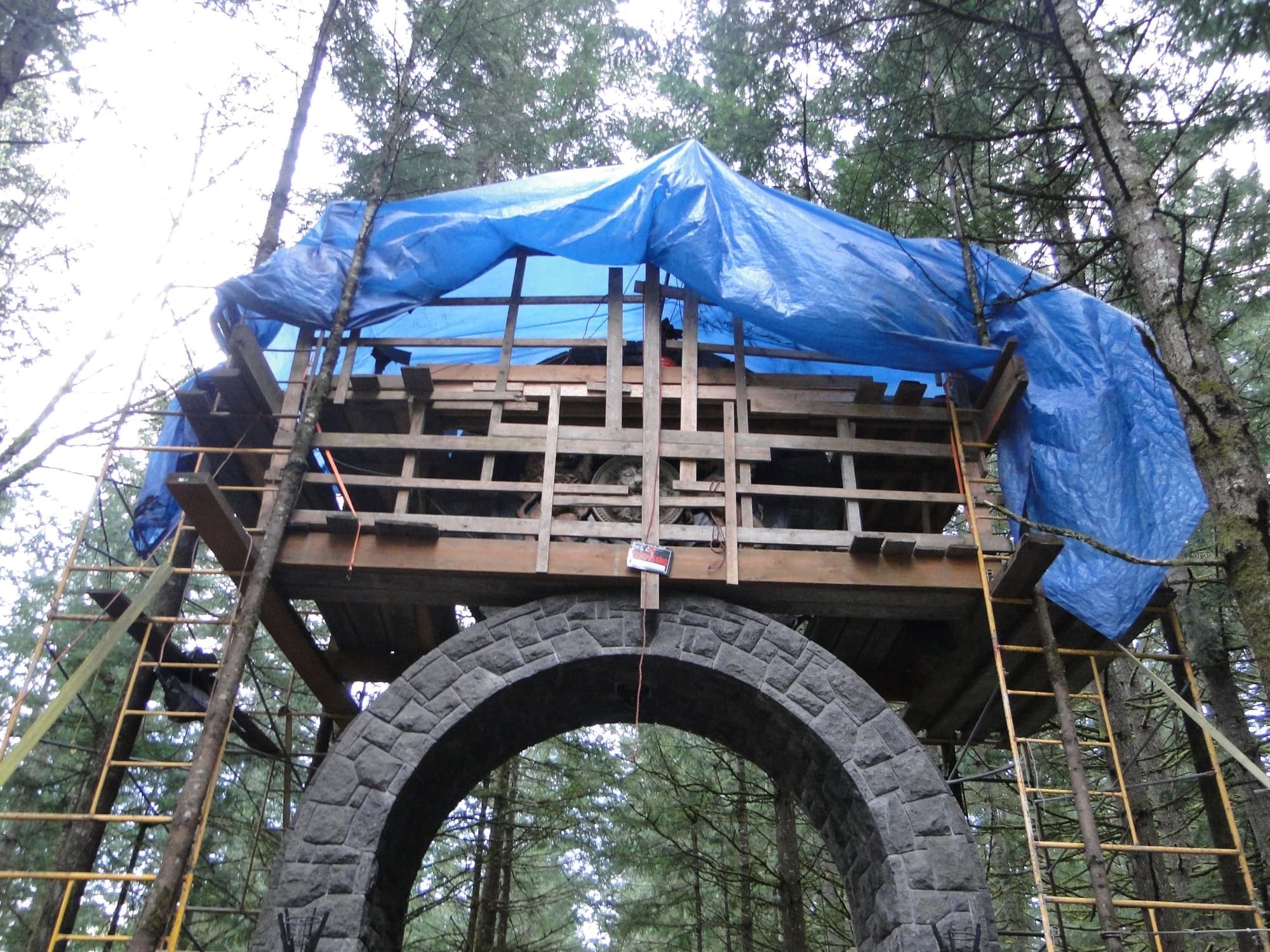Tarped scaffold stone archway