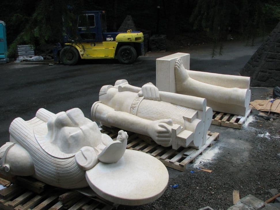 Three statue sections forklift